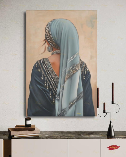 Berber Woman Wall Art, North African Portrait Print, Moroccan Tribal Canvas, Amazigh Culture Decor, Elegant Framed Canvas, Morocco Art Gift. Back-view portrait of a woman in a pale blue veil with an ornate silver headband, wearing a navy embroidered garment with silver beading and dangling ornaments, a floral silver earring, and a pearl necklace, against a warm beige textured background.