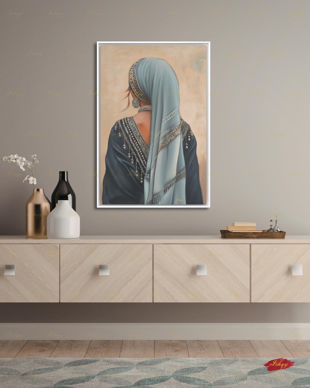 Berber Woman Wall Art, North African Portrait Print, Moroccan Tribal Canvas, Amazigh Culture Decor, Elegant Framed Canvas, Morocco Art Gift. Back-view portrait of a woman in a pale blue veil with an ornate silver headband, wearing a navy embroidered garment with silver beading and dangling ornaments, a floral silver earring, and a pearl necklace, against a warm beige textured background.