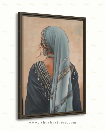 Berber Woman Wall Art, North African Portrait Print, Moroccan Tribal Canvas, Amazigh Culture Decor, Elegant Framed Canvas, Morocco Art Gift. Back-view portrait of a woman in a pale blue veil with an ornate silver headband, wearing a navy embroidered garment with silver beading and dangling ornaments, a floral silver earring, and a pearl necklace, against a warm beige textured background.