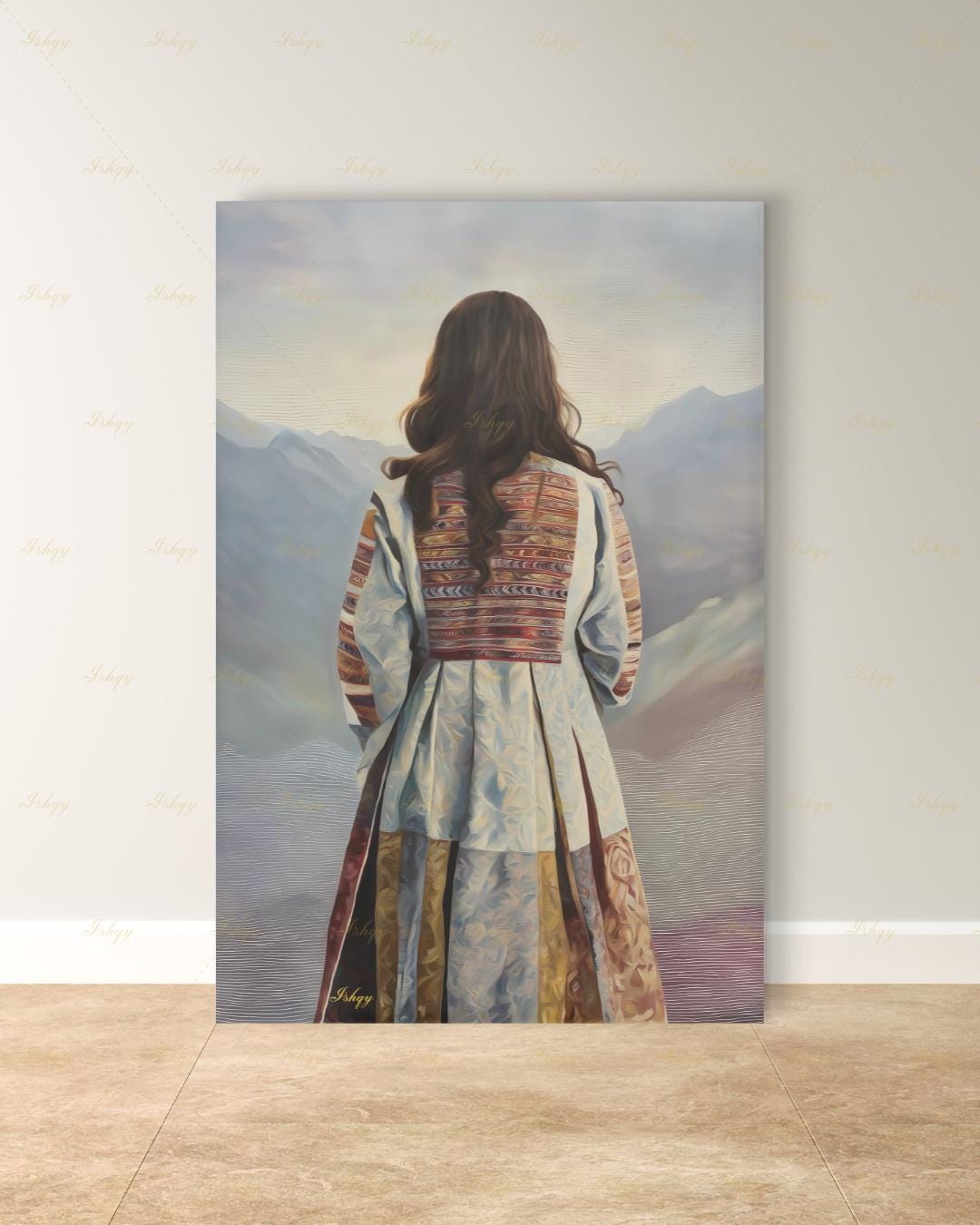 Back-view portrait of a woman with long dark wavy hair wearing a traditional Afghan embroidered dress with intricately paneled fabric in blue, rust, and earth tones, against a misty layered mountain landscape.